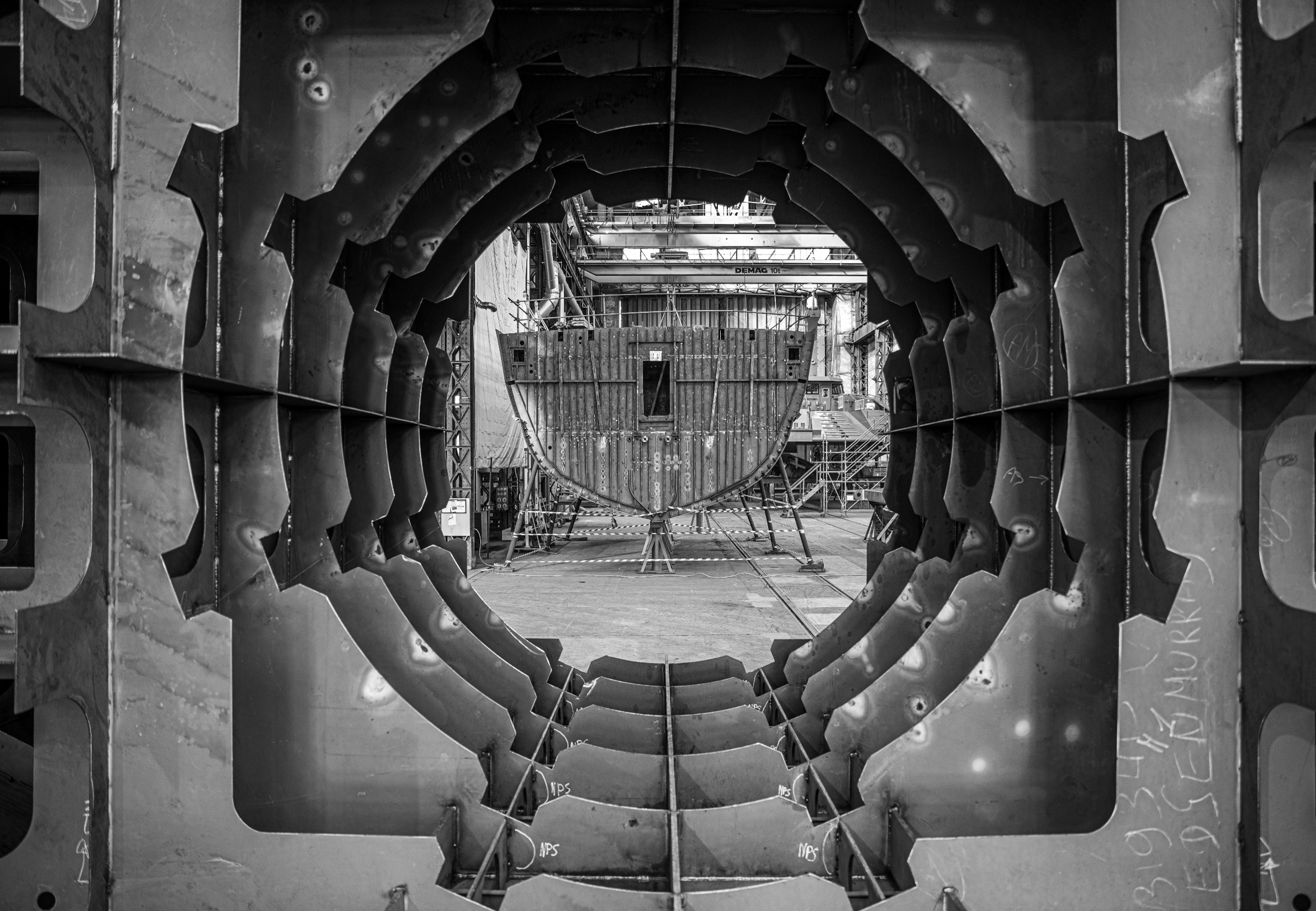Steel hull structure inside a naval shipyard